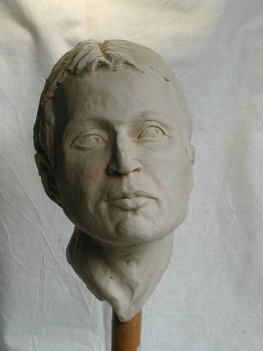 young man, portrait in clay