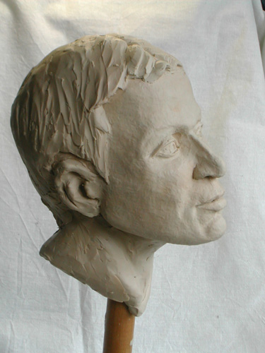 young man, portrait in clay